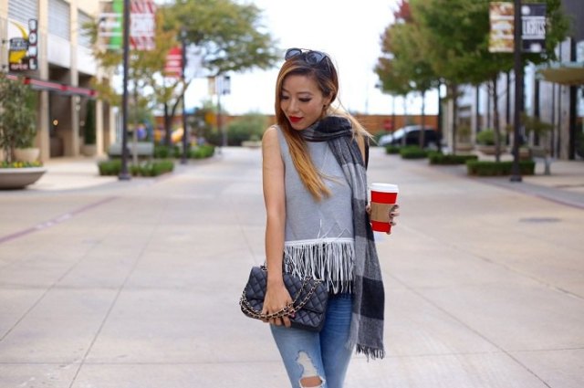gray sleeveless top with white fringes