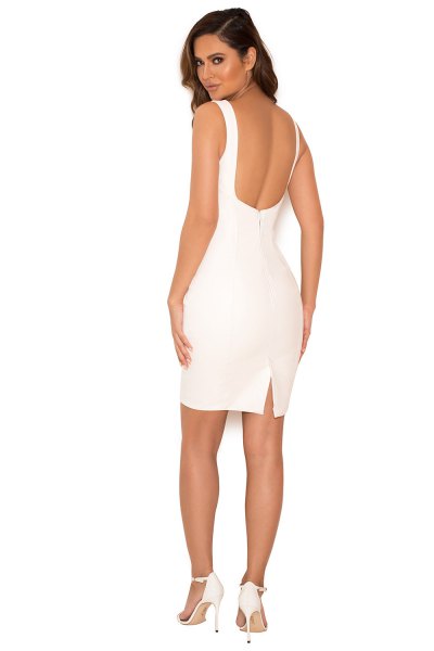 backless leather dress with white lace-up heels