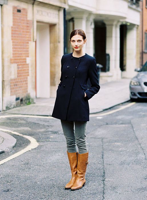 brown riding boots navy blue coat