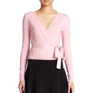 pale pink wrap sweater black skater skirt