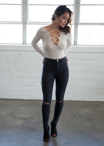 white ribs skinny fit criss cross sweater black jeans