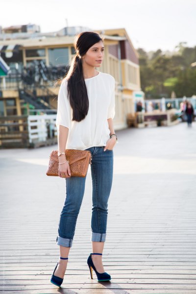 white blouse in cuffed skinny jeans