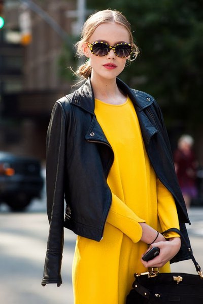 drape a black leather jacket over the yellow dress of the shoulders