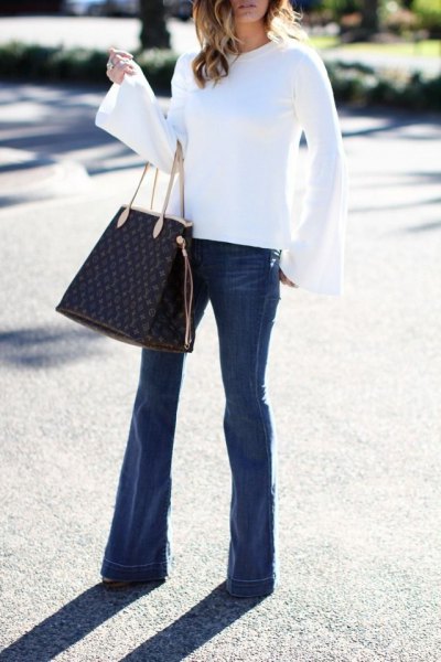 white watch sleeve blouse flare jeans outfit