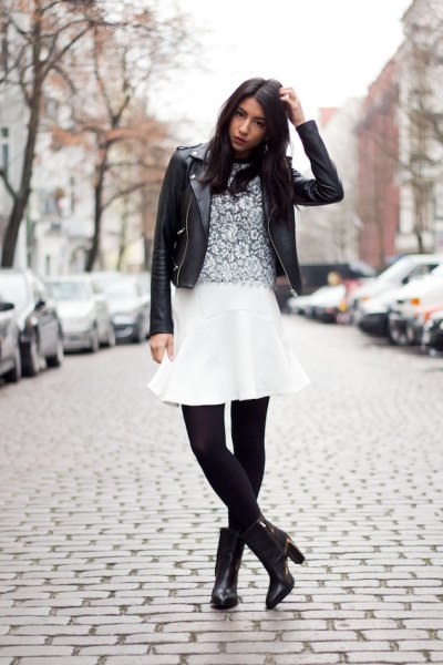 white flare skirt black leggings boots