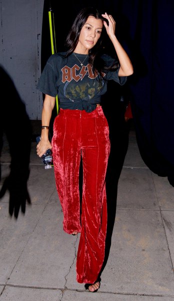 Wide-leg trousers in red velvet and black graphic T-shirt