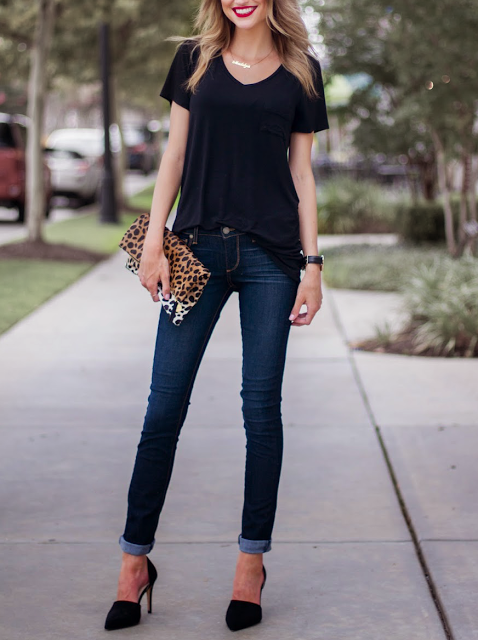 black t-shirt, blue jeans, black heels, leopard print purse .