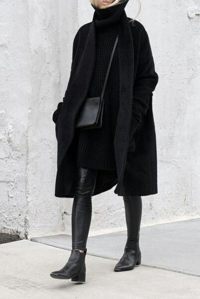 Black cashmere coat // black leather leggings // black boots .