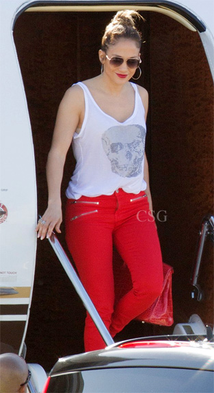 Jennifer Lopez White Skull Tank and Red Zipper Skinny Jeans .