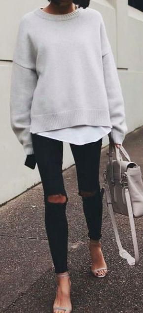 street style. jumper over blouse. ripped skinny jeans. strappy .