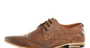 Brown low profile brogues - brogues / loafers - shoes / boots .