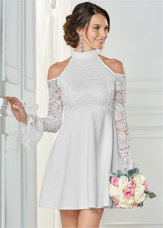 Sheer lace with slight bell sleeve and cold shoulders complements .